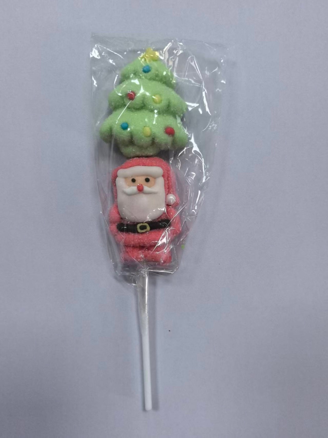 Christmas tree shaped artisan lollipop with sugar ornaments